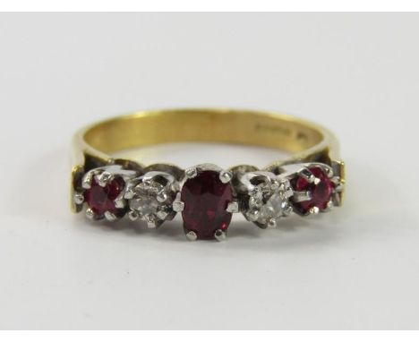 An 18ct gold ruby and diamond five stone ring, size O, 4.7g.