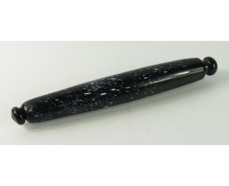 A Victorian black and speckled white glass rolling pin, 34cm long.