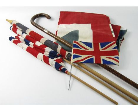 A George V walking stick with silver ferule, London 1935, and five Union flags, (6).