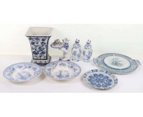 A pair of Delft lidded vases, signed WK 600 to base, 19cmH, with another Deflt lion candlestick signed to base, 20cmH, (3), a