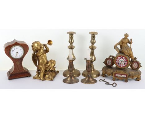 A French 19th century brass and porcelain mantle clock by Richard &amp; Cie Paris &amp; London, with lady to the top and pain