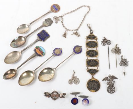 A group of silver and non silver cycling related items, including three cycling tie pins, a gilt and metal cycling key ring, 