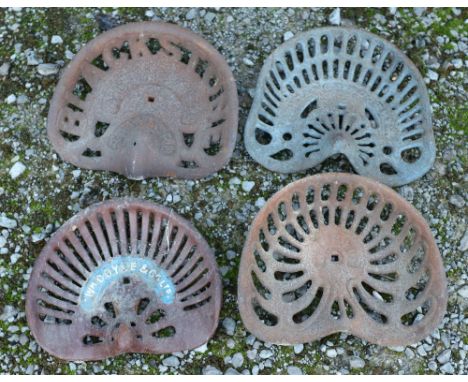 Four vintage iron tractor seats, including William Doyle &amp; Co, (4) Note: No in house shipping available for this lot