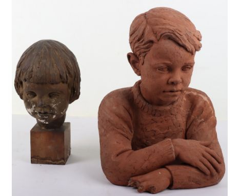 Doris Lindner (1896-1979), an Art Deco terracotta bust of a young boy, signed D Lindner, , and a plaster bust unsigned, Doris