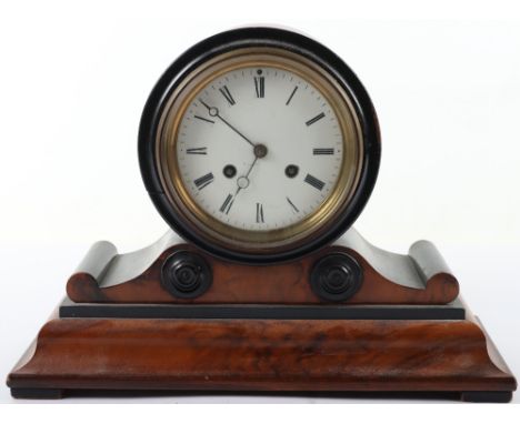 A Regency walnut and ebonised mantle clock, enamel dial, Roman numerals, eight day movement striking on a bell, 37cmW