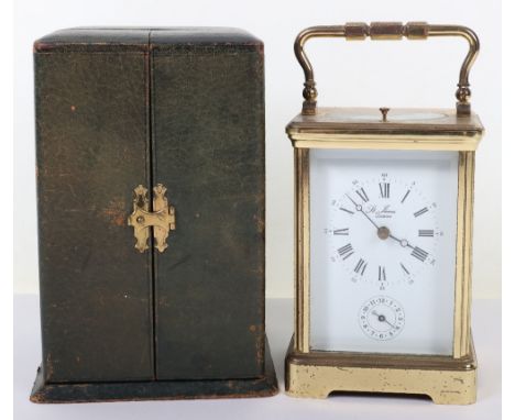 A St James retailed repeating carriage clock, enamel dial with Roman numeral and subsidiary dial, in a 19th century leather t