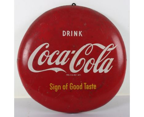 A Coca-Cola circular button sign ‘Drink Coca-Cola Sign of Good Taste’, 40.5cmDiam
