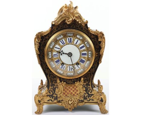 A mid 19th century gilt metal mantel clock, dial and movement marked 'James &amp; Walter Marshall, Paris', the embossed gilt 