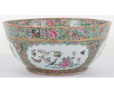 A 18th/19th century Chinese Canton famille verte punch bowl, rich enamel scenes in cartouches of flowers, birds and butterfly