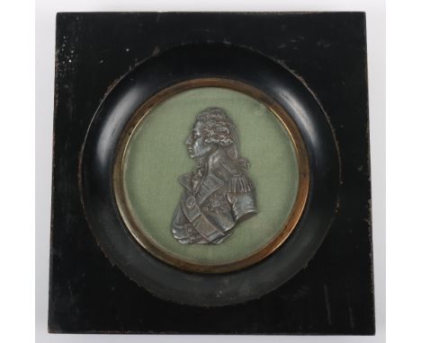 A 19th century portrait miniature in relief of Admiral Nelson in silvered metal, on green backing and framed, 16cmWx16.5cmH