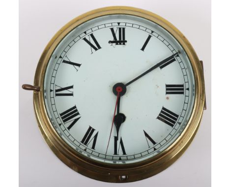 An early 20th century brass ships clock, white enamel dial with Roman numerals, 21cmDiamx10cmH