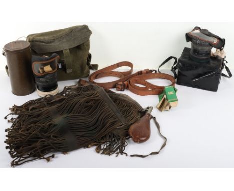 Four Waffen SS sniper veil contemporary copies, a civilian gas mask, a G&amp;JW Hawksley leather powder flask, and a military