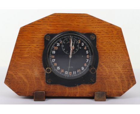 A WWII aircraft cockpit clock, possibly Spitfire, MK IIIB No. 1319/39R, Smith &amp; Sons London, mounted on oak backing, Ref 