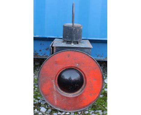 A railway red bulls eye buffer stop lamp with 12'' disc around lens Note: No in house shipping available for this lot