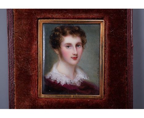 J. Roth, a gold framed enamelled miniature portrait of a gentleman with lace collar, signed 3.5 x 3cm, in fitted leather case