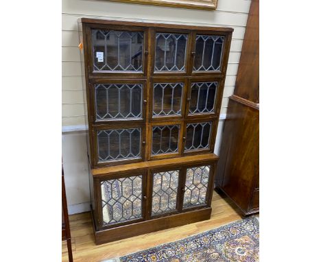 A Globe Wernicke type oak sectional bookcase, enclosed by leaded glazed doors, width 103cm, depth 37cm, height 163cm