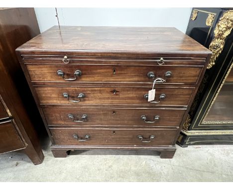 A Georgian mahogany straight front chest, fitted four graduated drawers and a slide, caddy top, brass handles and square brac