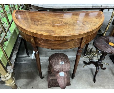 A George III banded mahogany D shaped folding card table, width 91cm, depth 46cm, height 72cm
Condition:&nbsp;Top has a light