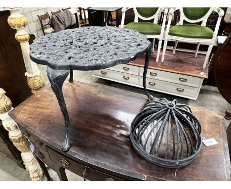 A circular aluminium low garden table, diameter 63cm, height 43cm together with four planter frames