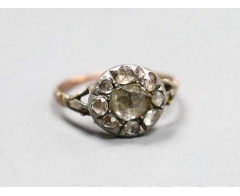 An early 19th century gold and silver mounted rose diamond cluster ring, size E, gross 1.7 grams
Condition:&nbsp;One shoulder