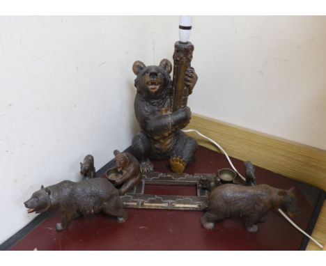 A group of Black Forest carved wood bears: a lamp, a book rack, etc.
&nbsp;
Condition:&nbsp;Lamp natural vertical split affec