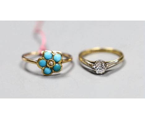 An 18ct gold and platinum solitaire diamond ring, size K, gross 2.1 grams and a turquoise set flowerhead ring, size N, gross 