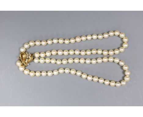 A two strand cultured pearl necklace, with white opal set 14ct gold clasp, 35cm