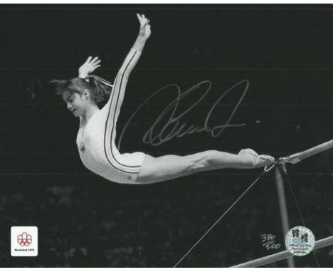 Nadia Comaneci autographed photo. Stunning black and white 8x10 photo autographed by Nadia Comaneci, the famous Romanian gymn