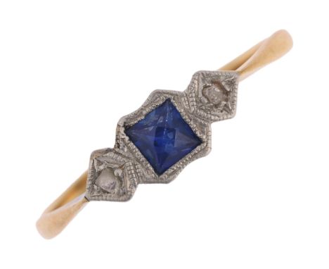 An Art Deco 18ct gold three stone sapphire and diamond ring, platinum-topped, set with square-cut sapphire and rose-cut diamo