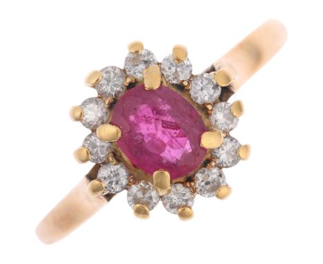 An 18ct gold ruby and diamond flowerhead cluster ring, claw set with oval mixed-cut ruby and modern round brilliant-cut diamo