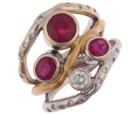 A large 18ct two-colour gold ruby and diamond openwork ring, maker H&T Ltd, setting height 20.5mm, size O, 14.7gNo damage or 