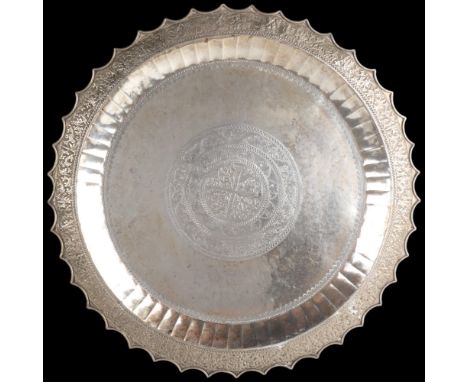 A large Malay silver platter tray, Malay Peninsular or Riau, 19th-early 20th century, with relief embossed kris decoration, u