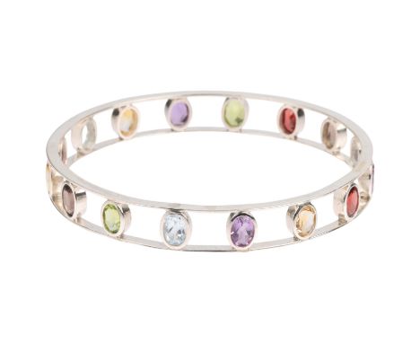 A sterling silver gem set openwork slave bangle, band width 10mm, internal circumference 19cm, 18.5gNo damage or repair, all 