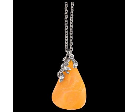 A large Art Nouveau style Danish sterling silver and butterscotch amber floral pendant necklace, on silver cable link chain, 
