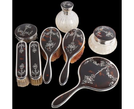 An Art Deco George V silver and tortoiseshell pique inlaid 8-piece dressing table vanity set, Adie Brothers Ltd, Birmingham 1