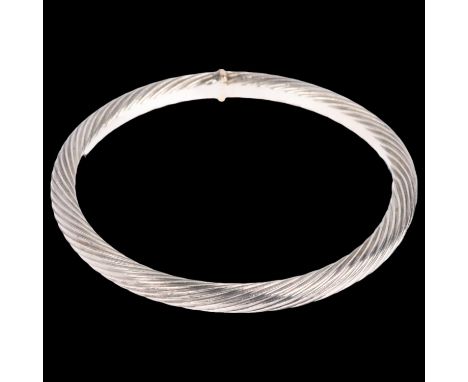 CLAUS GEORG MELCHER - a heavy Danish sterling silver twisted slave bangle, with silver-gilt mount, band width 5.8mm, internal