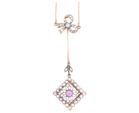 A fine Edwardian ruby and diamond openwork drop pendant necklace, the square flowerhead pierced drop rub-over set with round-