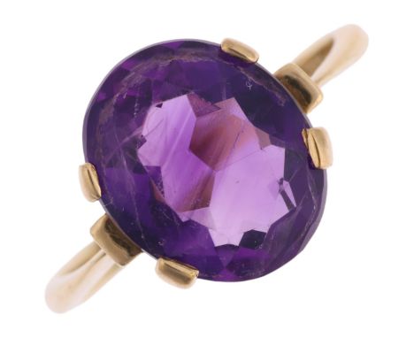 A late 20th century 9ct gold amethyst dress ring, maker LCF, London 1981, claw set with oval mixed-cut amethyst, setting heig