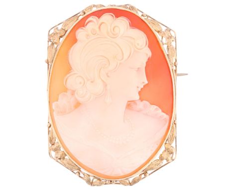 A large shell cameo brooch, relief carved depicting female profile, in unmarked 9ct gold frame, 59.8mm, 23gA few faint hairli