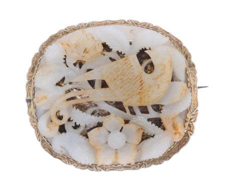 A Chinese celadon jade 'Tchitrec Bird Of Paradise' panel, carved and pierced settings, mounted in brooch frame, apparently un