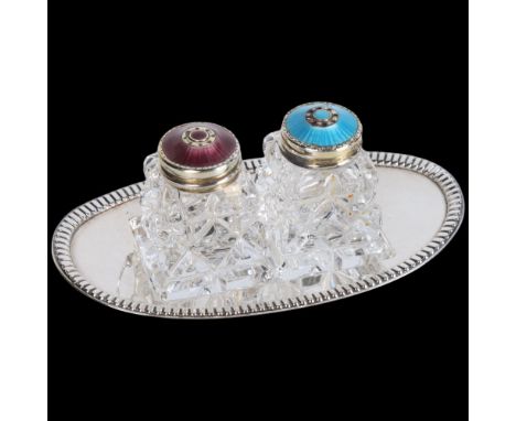 HROAR PRYDZ - a pair of Norwegian sterling silver-gilt blue and purple enamel glass cruets, on fitted silver plated oval tray