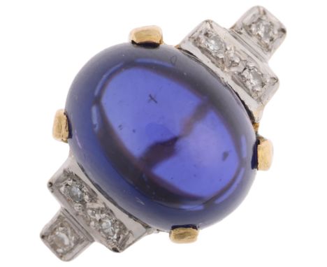 An 18ct gold iolite and diamond dress ring, maker S&R, London 1976, claw set with oval cabochon iolite and stepped eight-cut 
