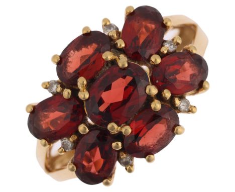 A modern 9ct gold garnet and diamond flowerhead cluster ring, setting height 13.9mm, size P, 5.5gNo damage or repair, all sto