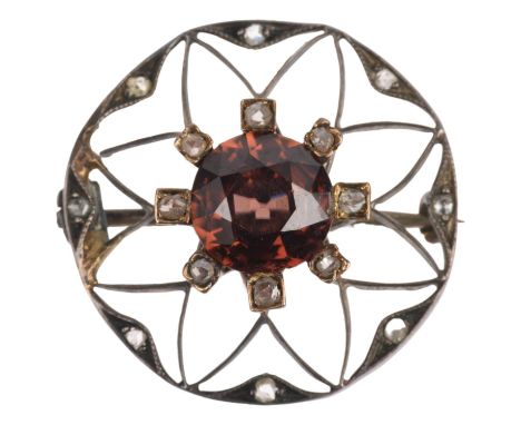 An Art Nouveau brown zircon and diamond flowerhead openwork brooch, apparently unmarked, 23mm, 3.4gAll stones present, zircon