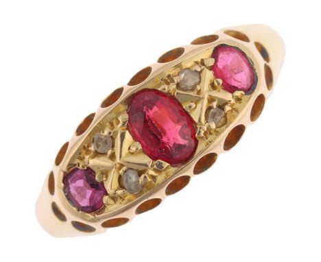 An early 20th century seven stone ruby and diamond half hoop ring, apparently unmarked, setting height 7mm, size L, 3gNo dama