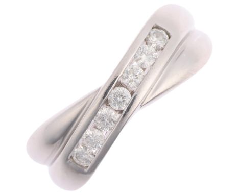 An 18ct white gold diamond crossover band ring, channel set with modern round brilliant-cut diamonds, total diamond content a
