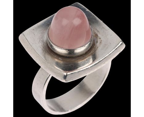 NIELS ERIK FROM - a a Danish modernist sterling silver rose quartz dress ring, concave square panel set with high round caboc