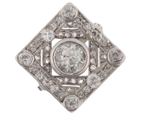 An Art Deco platinum diamond geometric panel ring, centrally set with 1.15ct old European-cut diamond surrounded by round and