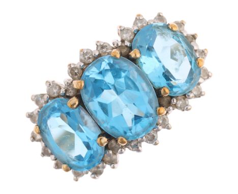 A 9ct gold blue topaz and diamond triple cluster ring, Birmingham 1999, setting height 11.1mm, size L, 3.3gNo damage or repai