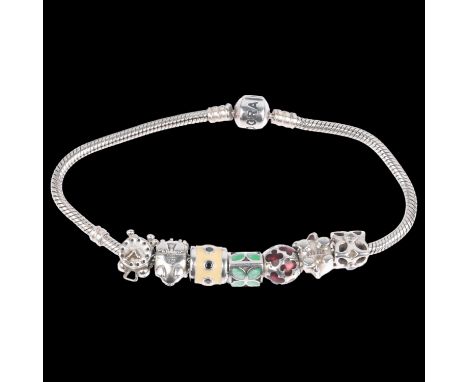 PANDORA - a sterling silver snake link charm bracelet, with 7 silver charms, 21cm, 40.8gNo damage or repair, only light surfa